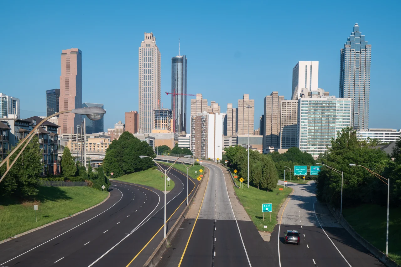 Downtown Atlanta’s skyline rises above the roads seen from Jackson Street Bridge.